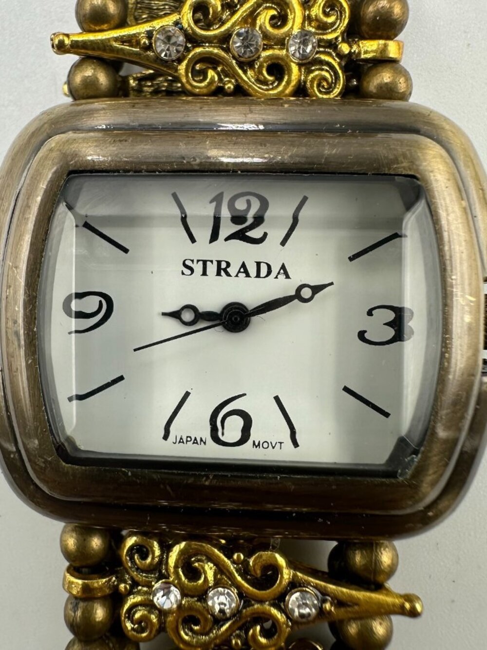 3/$30 Strada Watch Women Brass Tone Scroll Design Stretch Band 7.25 Inch